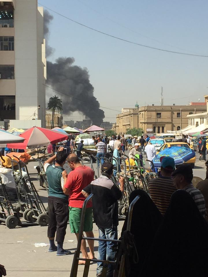Photo posted on social media showing a black smoke rising from the site of the explosion in Baghdad, Iraq, May 30, 2017.